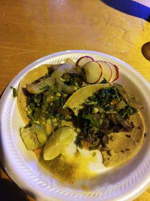 Plate of tacos with radishes and lime from Alley Tacos
